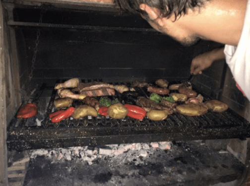 Preparing asado in the sweltering heat in buenos aires