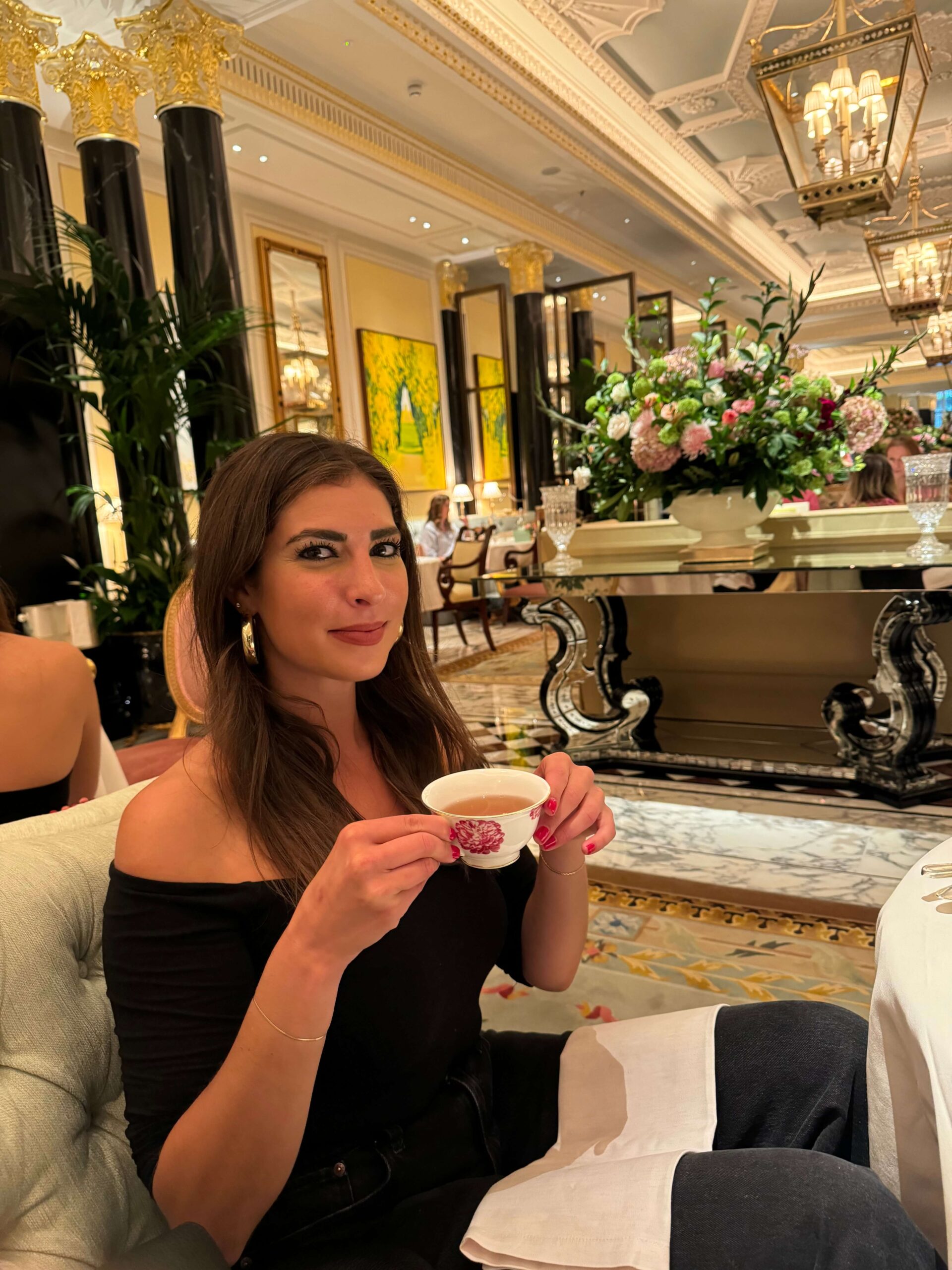 Sophie drinking tea at the Dorchester Hotel